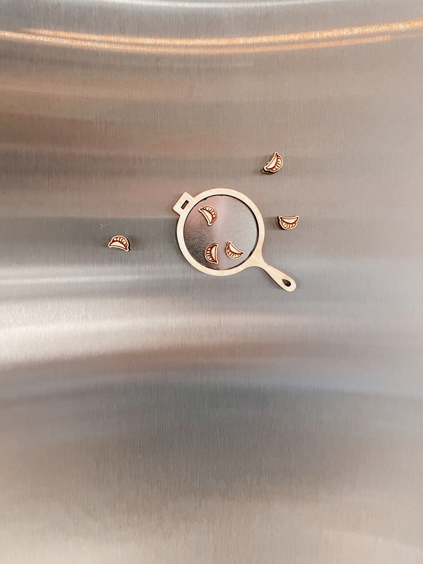 Tiny pan-fried dumpling magnets with frying pan